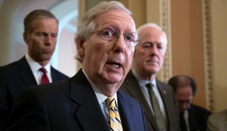 Senate Majority Leader Mitch McConnell, R-Ky., flanked by Sen. John Thune, R-S.D., left, and Majority Whip John Cornyn, R-Texas, speaks to the media on Capitol Hill in Washington, Tuesday, July 17, 2018. McConnell says there is "indisputable evidence" Russia tried to affect the 2016 presidential election. He says the Senate understands the "Russia threat" and that is the "widespread view here in the United States Senate among members of both parties."