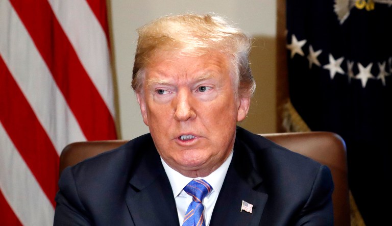 President Trump pauses during his meeting with members of his Cabinet in the Cabinet Room of the White House in Washington.