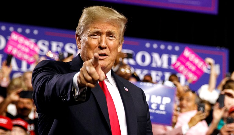 President Trump arrives for a campaign rally at Florida State Fairgrounds Expo Hall in Tampa, Fla.