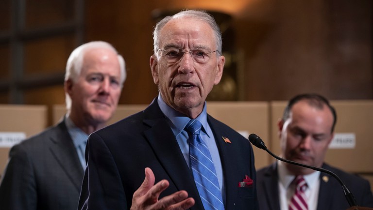Senate Judiciary Chairman Chuck Grassley, R-Iowa, flanked by Sen. John Cornyn, R-Texas, left, and Sen. Mike Lee, R-Utah, holds a news conference to refute Senate Democrats who are intensifying their fight over documents related to Supreme Court nominee Brett Kavanaugh's stint as staff secretary at the White House, on Capitol Hill in Washington, Thursday, Aug. 2, 2018.