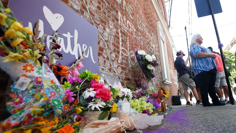 Susan Bro, mother of Heather Heyer who was killed during last year's Unite the Right rally, speaks with reporters at the spot where her daughter was killed in Charlottesville, Va.