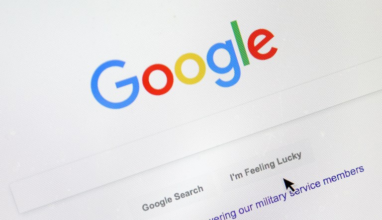 A cursor moves over Google's search engine page on Tuesday, Aug. 28, 2018, in Portland, Ore.