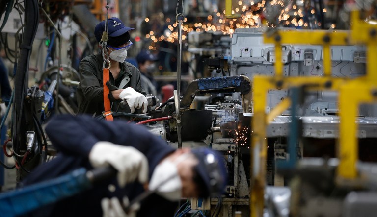 Workers weird on the BAIC Jeep chassis frames at the Chinese automaker BAIC ORU assembly plant in Beijing, Wednesday, Aug. 29, 2018.