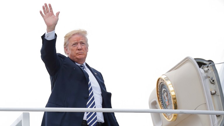 President Trump boards Air Force One at Andrews Air Force Base, Md.