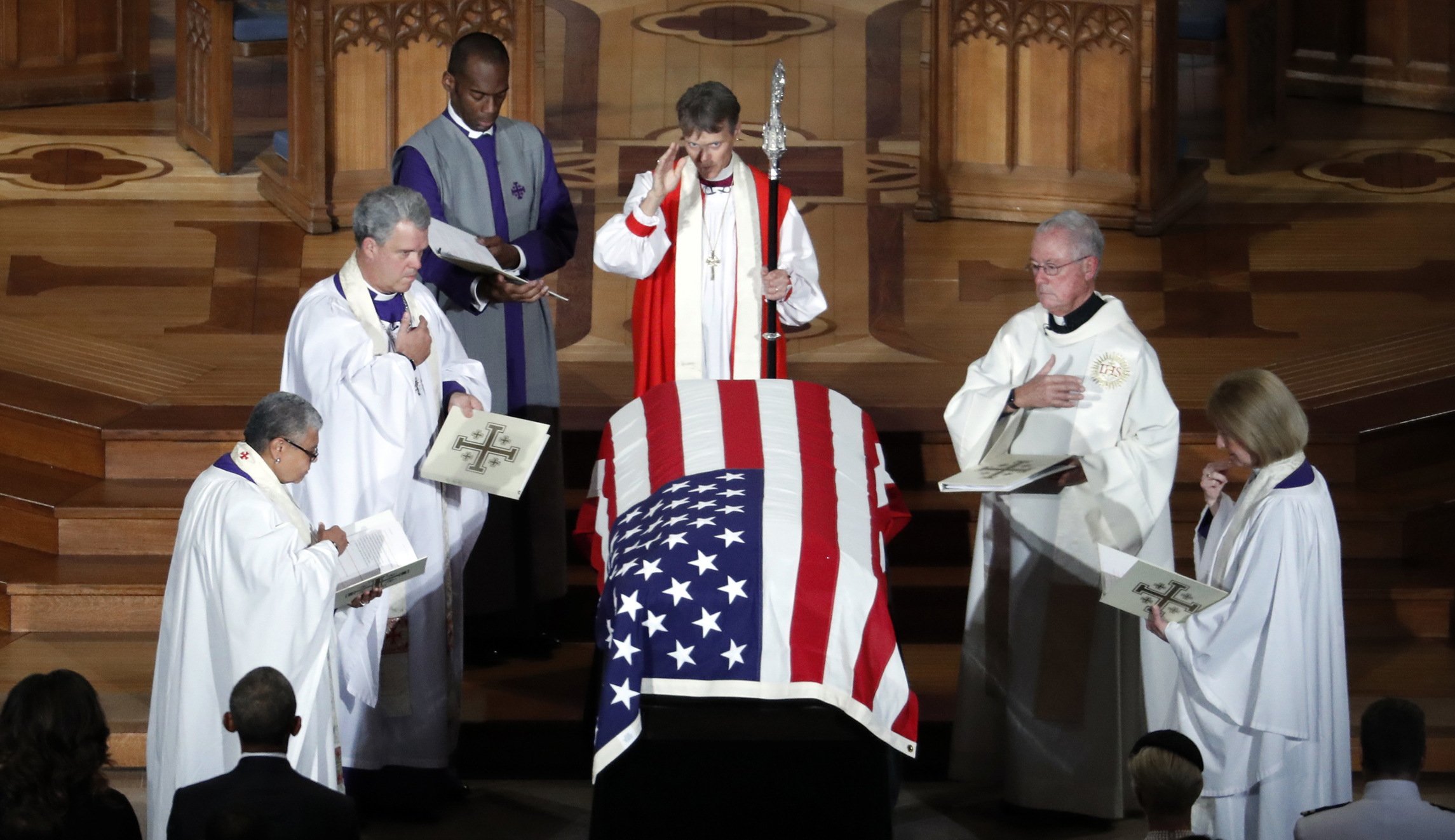 The casket of Sen. John McCain, R-Ariz., is blessed at the end of a memorial service at Washington National Cathedral in Washington on Saturday.