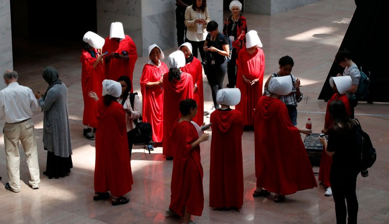 Demonstrators protesting against Supreme Court nominee Brett Kavanaugh, wear costumes from the show "The Handmaid's Tale," during his confirmation hearing with the Senate Judiciary Committee on Capitol Hill, Tuesday, Sept. 4, 2018, in Washington.