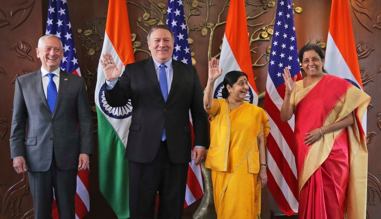 From left, U.S. Defense Secretary James Mattis, U.S. Secretary of State Mike Pompeo, Indian Foreign Minister Sushma Swaraj and Indian Defense Minister Nirmala Sitharaman raise their hands before a meeting in New Delhi, India, Thursday, Sept. 6, 2018. Pompeo and Mattis are holding long-delayed talks Thursday with top Indian officials, looking to shore up the alliance with one of Washington's top regional allies. 
