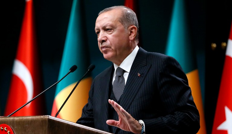 Turkish President Recep Tayyip Erdogan talks to members of the media during a news conference at the Presidential Palace in Ankara, Turkey.