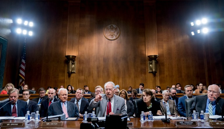 Senate Judiciary Committee Chairman Chuck Grassley, R-Iowa, center, accompanied by Sen. Lindsey Graham, R-S.C., left, Sen. Orrin Hatch, R-Utah, second from left, Sen. Dianne Feinstein, D-Calif., the ranking member, second from right, and Sen. Patrick Leahy, D-Vt., right, speaks during a Senate Judiciary Committee markup meeting.