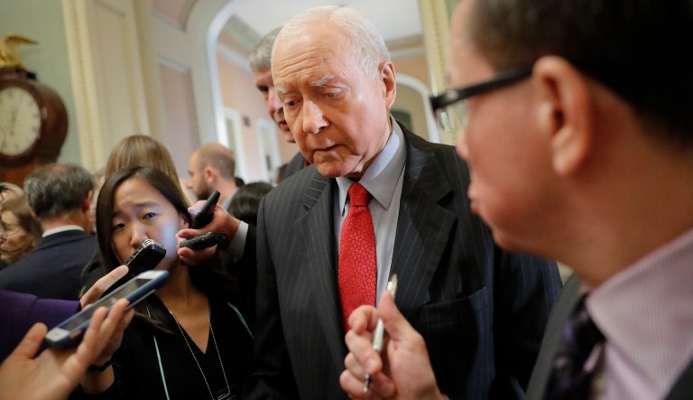 Senate Judiciary committee member Sen. Orrin Hatch, R-Utah, center, speaks to members of the media as he walks to Senate Chamber floor on Capitol Hill in Washington, Tuesday, Sept. 18, 2018.