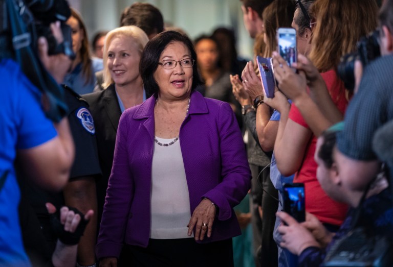 Sen. Mazie Hirono, D-Hawaii, is applauded by demonstrators as she arrives to speak to reporters in support of professor Christine Blasey Ford.