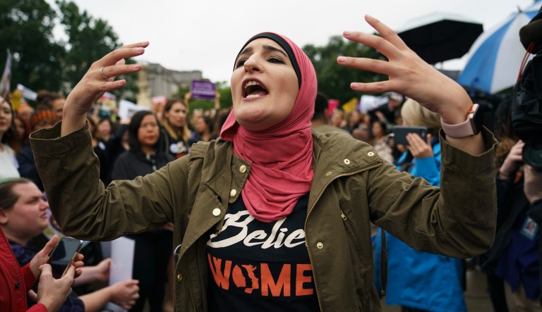 Linda Sarsour with Women's March calls out to other activists opposed to President Trump's embattled Supreme Court nominee, Brett Kavanaugh, in front of the Supreme Court on Capitol Hill in Washington, Monday, Sept. 24, 2018.