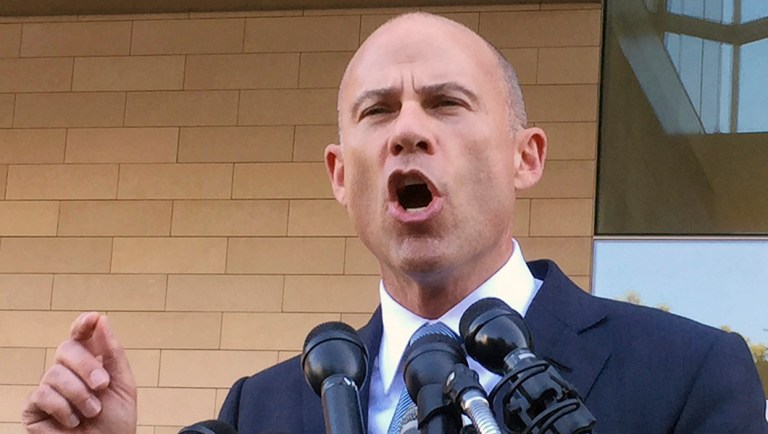 Michael Avenatti talks to reporters after a federal court hearing in Los Angeles.