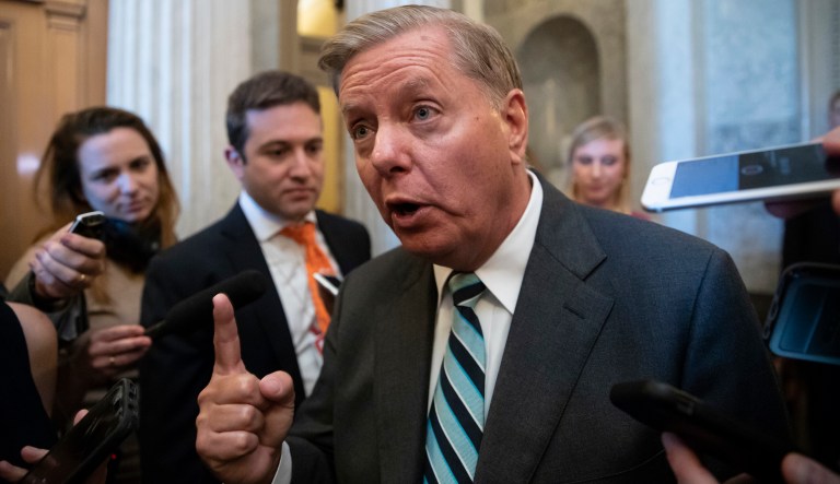 Sen. Lindsey Graham, R-S.C., a member of the Senate Judiciary Committee, makes an emphatic point to reporters about Brett Kavanaugh's accusers as he arrives for a vote at the Capitol in Washington, Wednesday, Sept. 26, 2018.