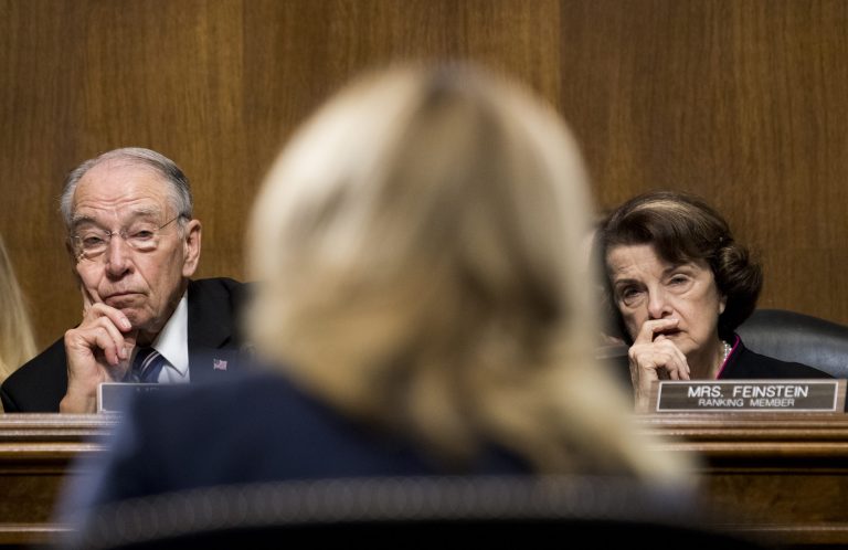Senate Judiciary Committee Chairman Chuck Grassley, R-Iowa, and Sen. Dianne Feinstein, D-Calif., listen as Christine Blasey Ford testifies before the Senate Judiciary Committee, Thursday, Sept, 27, 2018 on Capitol Hill in Washington.