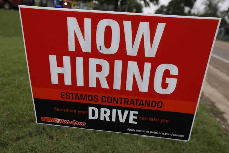 A bilingual help wanted sign for Auto Zone, a retailer of aftermarket automotive parts and accessories, is posted in Canton, Miss., Thursday, Sept. 27, 2018.