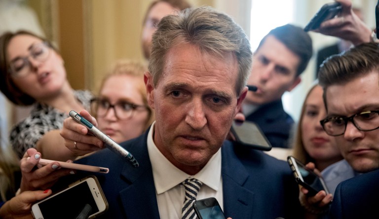Sen. Jeff Flake, R-Ariz., speaks with reporters after meeting with Senate Majority Leader Mitch McConnell, R-Ky., in his office in the Capitol in Washington, Friday, Sept. 28, 2018.