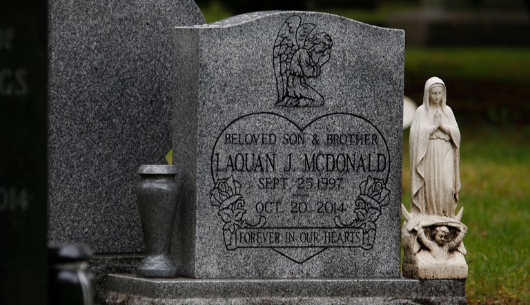 A tombstone marks the grave of Laquan McDonald at the Forest Home Cemetery in Forest Park, Ill., on Friday as jurors continued deliberations in the trial of the Chicago police officer Jason Van Dyke, who shot and killed McDonald in 2014. 
