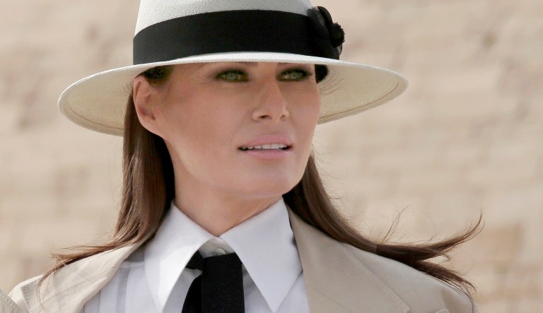 First lady Melania Trump poses for photojournalists in front of the ancient statue of Sphinx, with the body of a lion and a human head, at the historic site of the Giza Pyramids, in Egypt, Saturday, Oct. 6, 2018. First lady Melania Trump is visiting Africa on her first big solo international trip.