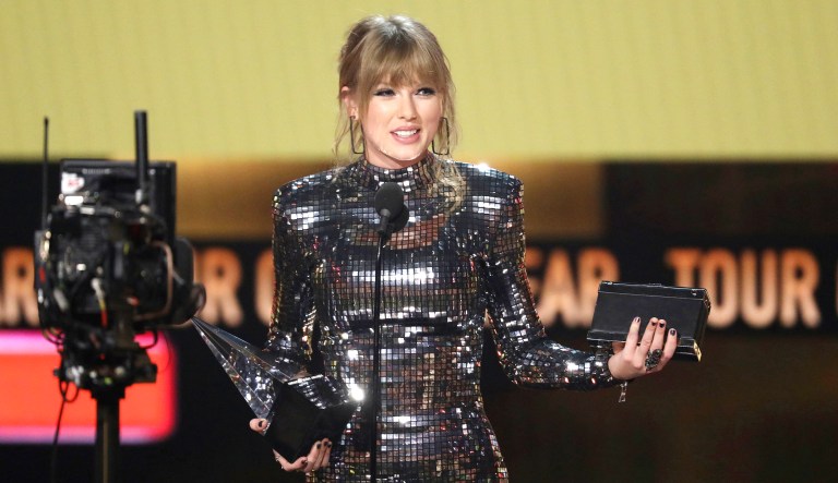 Taylor Swift accepts the award for tour of the year at the American Music Awards on Tuesday at the Microsoft Theater in Los Angeles. 