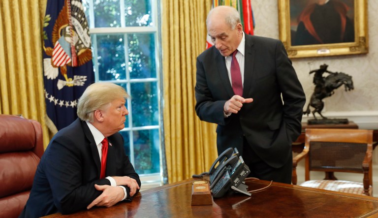 President Donald Trump listens to White House Chief of Staff John Kelly, right, following Trump's meeting to discuss potential damage from Hurricane Michael, in the Oval Office of the White House in Washington, Wednesday, Oct. 10, 2018.