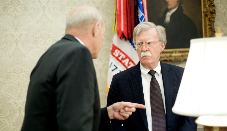 White House chief of staff John Kelly (left) talks with White House national security adviser John Bolton (right) in the Oval Office of the White House in Washington.