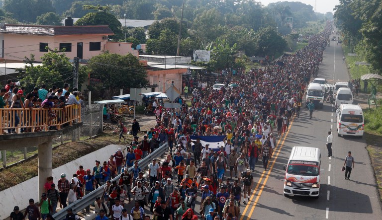 Central American migrants walking to the U.S. start their day departing Ciudad Hidalgo, Mexico, Sunday, Oct. 21, 2018. Despite Mexican efforts to stop them at the border, about 5,000 Central American migrants resumed their advance toward the U.S. border early Sunday in southern Mexico.