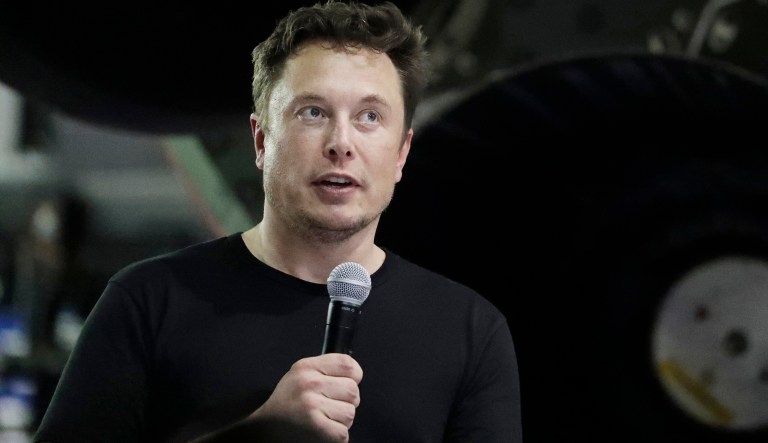 FILE- In this Sept. 17, 2018, file photo Tesla CEO and SpaceX founder and chief executive Elon Musk speaks after announcing Japanese billionaire Yusaku Maezawa as the first private passenger on a trip around the moon in Hawthorne, Calif. Tesla Inc. reports earnings on Wednesday, Oct. 24.