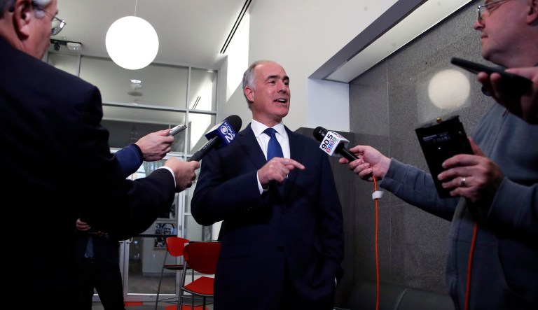 Sen. Bob Casey, D-Pa., center, is interviewed by reporters following his second debate with Republican challenger Rep. Lou Barletta, Friday Oct. 26, 2018, in the studio of KDKA-TV in Pittsburgh. Casey, 58, of Scranton, is seeking a third six-year term.