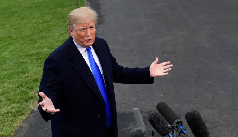 President Trump talks with reporters.