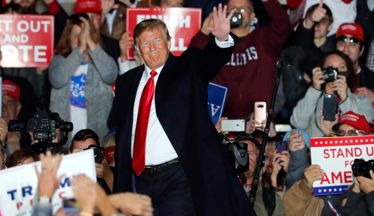 President Donald Trump waves as he leaves the stage after speaking to supporters during a rally at Southern Illinois Airport Saturday, Oct. 27, 2018, in Murphysboro, Ill.