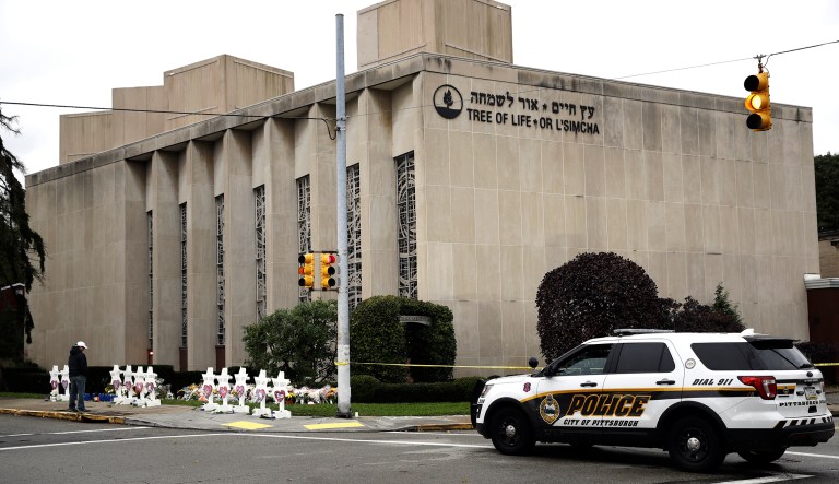 A police vehicle is posted near the Tree of Life/Or L'Simcha Synagogue in Pittsburgh, Monday, Oct. 29, 2018. Tree of Life shooting suspect Robert Gregory Bowers is expected to appear in federal court Monday. Authorities say he expressed hatred toward Jews during the rampage Saturday morning and in later comments to police.