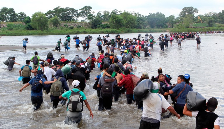 Salvadoran migrants cross the Suchiate river, the border between Guatemala and Mexico, on Friday.
