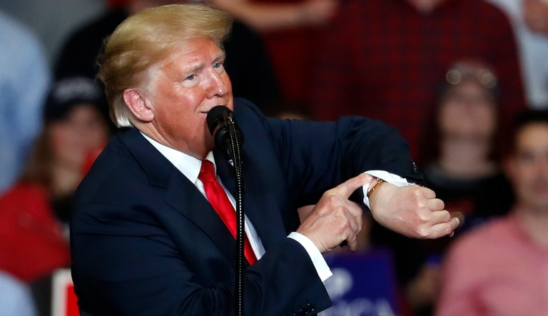 President Donald Trump looks at his watch near the end of a campaign rally Monday, Nov. 5, 2018, in Cape Girardeau, Mo.