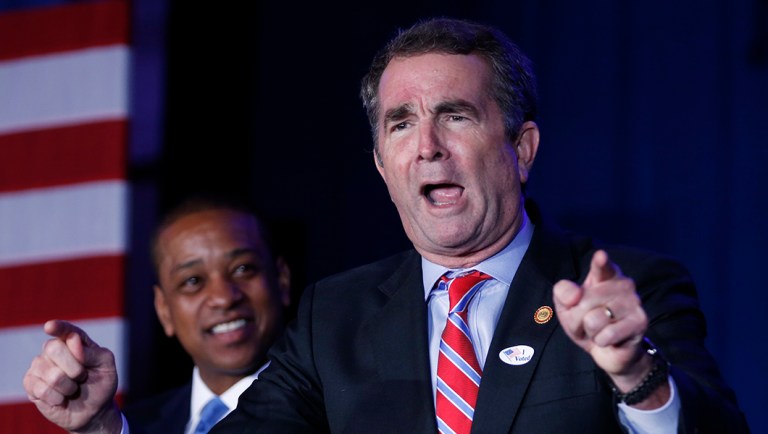 Virginia Gov. Ralph Northam gestures during an election party.