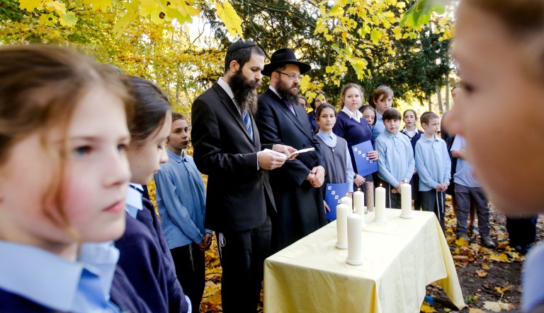 Rabbi Yehuda Teichtal, center right, and Rabbi David Gewirtz, center left, pray during an event to commemorate the victims of the Nov. 9, 1938 terror against the Jews in Germany at the Jewish Traditional School in Berlin, Wednesday, Nov. 7, 2018. On the event the school also remember to the victims of the anti-Semitic attack at the Tree of Life Synagogue in Pittsburgh on Oct. 27, 2018.