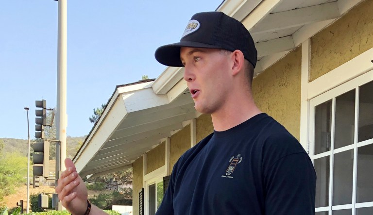 Brendan Kelly speaks with reporters outside his home in Thousand Oaks, Calif. Kelly, a Marine who was at Borderline Bar and Grill on Wednesday night, helped people get out after a gunman opened fire at the establishment. Kelly also survived the Las Vegas Route 91 Harvest Festival shooting in 2017.