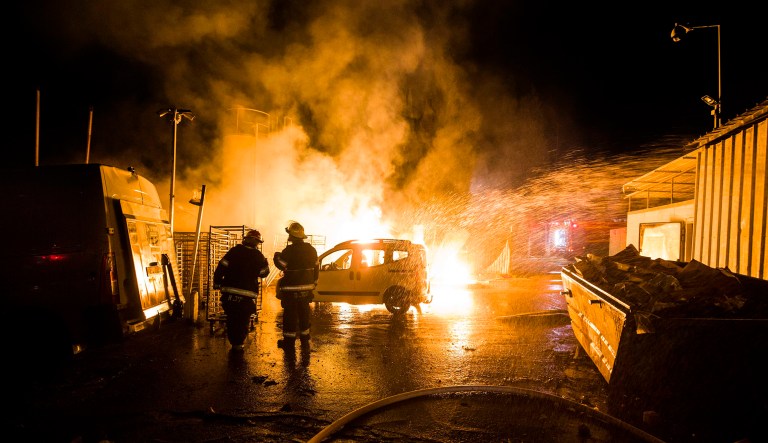 Israeli firefighters work at the scene where a rocket fired from the Gaza Strip hit in Sderot, Israel, Monday, Nov. 12, 2018. Israel's military says it is prepared to step up its efforts against Palestinian militants in the Gaza Strip if rocket fire at Israel continues.
