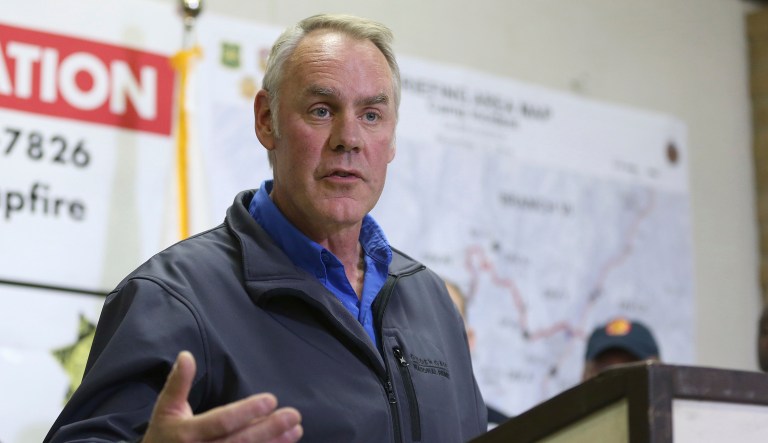 Ryan Zinke, secretary of the Interior responds to a reporter's question during a news conference after touring the fire ravaged town of Paradise, Calif, Wednesday, Nov. 14, 2018.