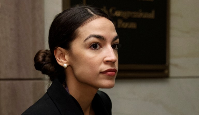 Rep.-elect Alexandria Ocasio-Cortez, D-N.Y., walks to member-elect briefings on Capitol Hill in Washington, Thursday, Nov. 15, 2018.