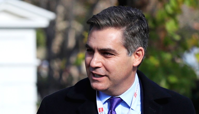CNN's Jim Acosta walks at the North Lawn of the White House.