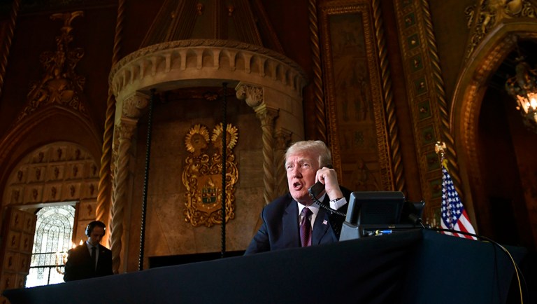 President Trump talks with troops via teleconference from his Mar-a-Lago estate.