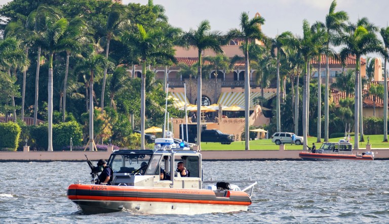 The U.S. Coast Guard patrol boat passes President Donald Trump's Mar-a-Lago estate in Palm Beach, Fla., Thursday, Nov. 22, 2018. President Trump made a Thanksgiving Day call to members of the U.S. military from his estate before traveling to a nearby Coast Guard Station to meet with members of the U.S. Coast Guard personally.