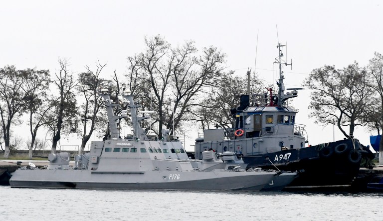 Three Ukrainian ships are seen as they docked near the Kerch after been seized ate Sunday, Nov. 25, 2018, in Kerch, Crimea, Monday, Nov. 26, 2018. The Ukrainian parliament is set to consider a presidential request for the introduction of martial law in Ukraine following an incident in which Russian coast guard ships fired on Ukrainian navy vessels. 
