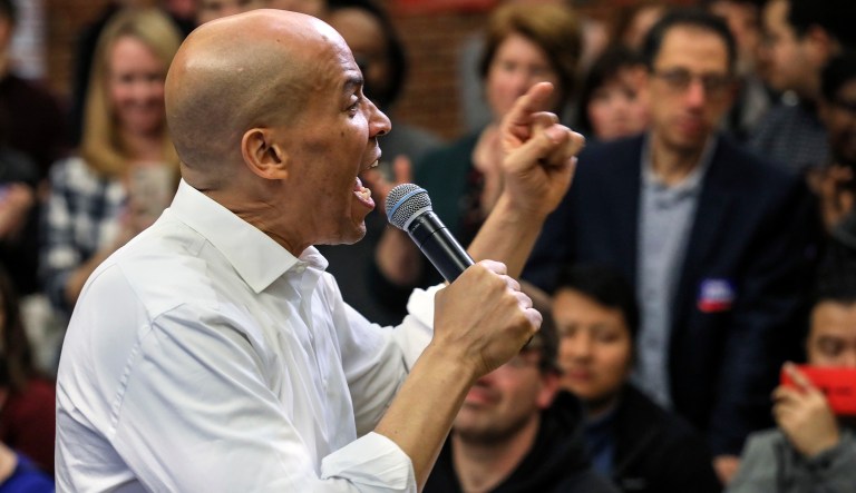 FILE - In this Oct. 28, 2018, file photo, New Jersey Sen. Cory Booker speaks at a get out the vote event hosted by the New Hampshire Young Democrats in Durham, N.H. As Democrats begin to think about the 2020 presidential race, they face a choice between pragmatists who may be able to flip states that President Trump won in 2016 and those such as Booker, Sen. Kamala Harris of California, or Beto O'Rourke of Texas, whose inspirational personal stories may connect with voters on a more emotional level.