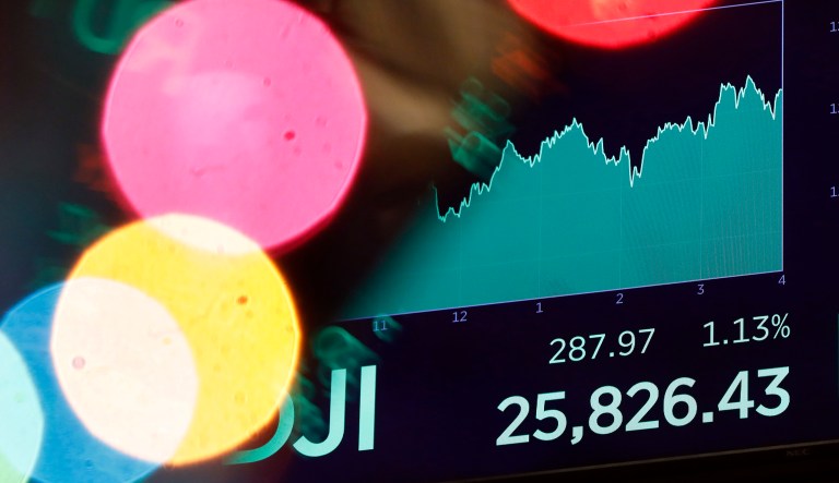 A board above the floor of the New York Stock Exchange shows the closing number for the Dow Jones industrial average, Monday, Dec. 3, 2018. Stocks finished solidly higher on Wall Street as investors welcomed news of a 90-day truce in the trade battle between the U.S. and China.