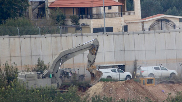 Israeli military digger works on the border with Lebanon in the northern Israeli town of Metula.