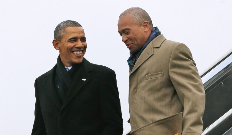 FILE - In this March 5, 2014 file photo, President Barack Obama, left, speaks with then-Massachusetts Gov. Deval Patrick upon arrival on Air Force One at Boston Logan International Airport in Boston. . Three sources confirmed Wednesday, Dec. 5, 2018, that Patrick will soon announce he will not launch a presidential campaign in 2020. 