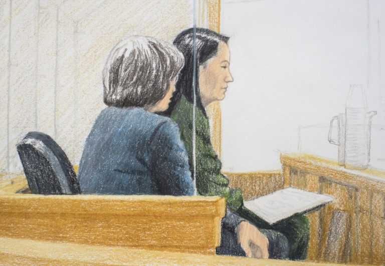 In this courtroom sketch, Meng Wanzhou, right, the chief financial officer of Huawei Technologies, sits beside a translator during a bail hearing at British Columbia Supreme Court in Vancouver, on Friday, Dec.  7, 2018.  Meng faces extradition to the U.S. on charges of trying to evade U.S. sanctions on Iran. She appeared in a Vancouver court Friday to seek bail.