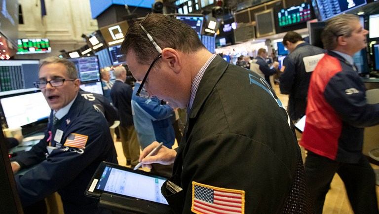 Traders work at the New York Stock Exchange.
